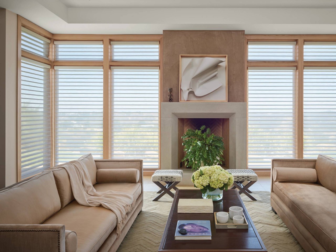 Bright living room with large windows outfitted with Hunter Douglas PowerView® Automation