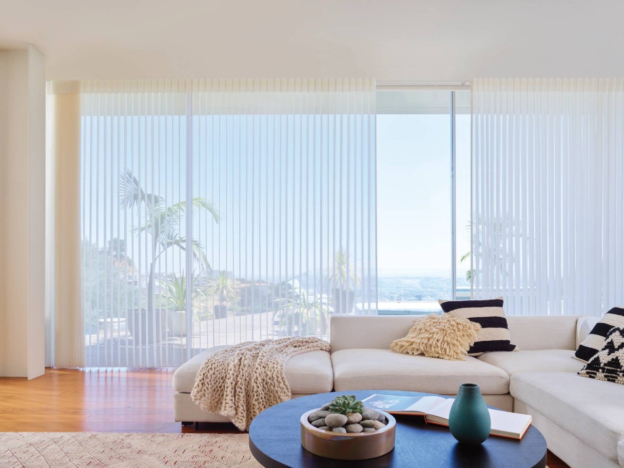 Large apartment window covered with Hunter Douglas Luminette® Privacy Sheers at Custom Window Decor of Jupiter near Jupiter, FL